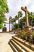 Flowers surrounding the bell tower and church in the old town of Antigua, Fuerteventura, Canary Islands, Spain