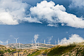 Clouds over wind turbines along the fjord, Troms county, Norway