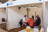 Meeting with a doctor before the inoculation, covid 19 vaccination center, gymnasium, les sables d'olonne, vendee, pays de loire, france, europe
