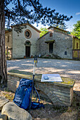 Backpack and map. Santa Reparata, Modigliana, Forlì, Emilia Romagna, Italy, Europe.