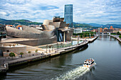 Spain travel city, view at sunset of the Frank Gehry designed Guggenheim Museum in the center of Bilbao, northern Spain.