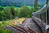 Outisde carriages of Transcantabrico Gran Lujo luxury train travellong across northern Spain, Europe. Journey between Unquera and Cabezon de la Sal.