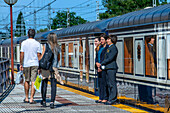 Outside of Transcantabrico Gran Lujo luxury train travellong across northern Spain, Europe. Hostesses receiving the passengers in Cabezon de la Sal, Cantabria, Spain.