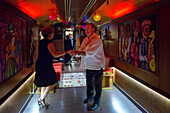 Inside of Transcantabrico Gran Lujo luxury train travellong across northern Spain, Europe. Interior of discotheque car. Party celebration.
