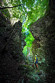 Climber admiring rocks. Europe, Italy, Trentino, Trento province, Cadino