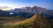 Tourist admiring Marmolada mountain Europe, Italy, Trentino Alto Adige, Bolzano province, Canazei