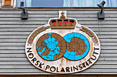 The Norway Polar Institute sign at the research station of Ny-Alesund. Ny-Alesund, Kongsfjorden, Spitsbergen Island, Svalbard, Norway.
