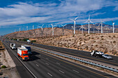 Traffic passes a wind farm in the San Gorgonio Pass near Palm Springs. San Gorgonio Pass, San Jacinto Mountains, Riverside County, California, USA.