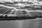 Sun rays over Thames, London, UK