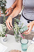 Summery bouquets of flowers as table decoration