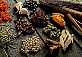 Various spices on a rustic wooden background