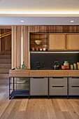 Modern kitchen unit with wooden elements and integrated lighting