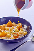 Rice pudding with pineapple, spices and gold leaf