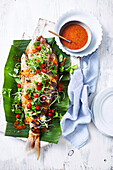 Snapper in banana leaves with thai herb salad