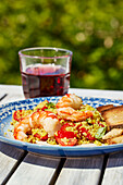 Tomato couscous with prawns