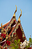 Tiered roof with cho fa finials on a viharn at Wat Pho Buddhist Temple, Bangkok, Thailand.