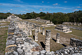 The Temple of the Fishertman or Templo del Pescador and colonnades in the ruins of the Post-Classic Mayan city of Mayapan, Yucatan, Mexico.