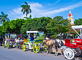 Horse drawn wagons in Granada Nicaragua. Granada was founded in 1524 and it's the first European city in mainland America