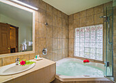 Luxury jacuzzi hot tub bath in a stylish bathroom at luxury hotel accommodation, Rarotonga, Cook Islands, South Pacific