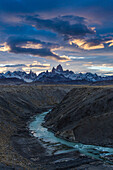 The Fitz Roy Massif at sunset, viewed over the canyon of the Rio de las Vueltas in Los Glaciares National Park near El Chalten, Argentina. A UNESCO World Heritage Site in the Patagonia region of South America.