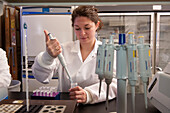 Scientist conducting an experiment in a laboratory