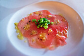 Beef carpaccio served in the restaurant of the luxury Paul Gauguin cruise, Society Islands, Tuamotus Archipelago, French Polynesia, South Pacific.
