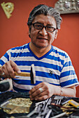 Artisan portrait at La Ronda, a famous street in the Historic Centre of the Old City of Quito, Ecuador, South America