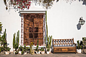 Cacti, Bougainvillea, wrought iron and woodwork in the patio at Museo Larco in Lima, Peru.