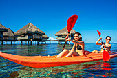 Kayaking in front Le Meridien Hotel on the island of Tahiti, French Polynesia, Tahiti Nui, Society Islands, French Polynesia, South Pacific.