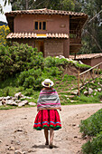 Quechua woman wearing traditional clothing and hat in Misminay Village, Sacred Valley, Peru.