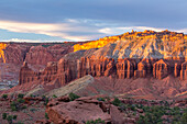 Sunset light on the Mummy Cliff from Panorama Point in Capitol Reef National Park in Utah. Chimney Rock is at far left.
