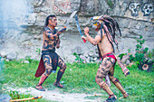 Two Native Americans in a Machete fight during the festival of Valle del Maiz in San Miguel de Allende ,Mexico.