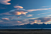 Spectacular lenticular clouds at sunset over Lago Viedma in Los Glaciares National Park near El Chalten, Argentina. A UNESCO World Heritage Site in the Patagonia region of South America.