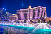 Bellagio hotel and the dancing fountains in Las Vegas. Bellagio is a luxury hotel and casino located on the Las Vegas Strip. The Bellagio opened on 1998.