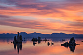 Mono Lake tufa formations and Sierra Nevada Mountains at sunrise; Mono Lake Tufa State Reserve, California