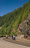 Motorcyclists riding on Highway 101 at on the Oregon Coast.