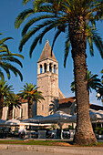 Church and Monastery of St Dominic, Trogir, Dalmatian Coast, Croatia, Europe. This photo shows the Church and Monastery of St Dominic in Torgir, Croatia. Trogir is a beautiful old town on the Dalmatian Coast of Croatia and is on the UNESCO World Heritage List thanks to it's stunning Romanesque Cathedral's and architecture. The cobbled streets of the Historic City of Trogir are littered with beautiful buildings and towering spires, places to visit and things to do. After visiting the Cathedral of St Lawrence, St Lawrence Square and Kamerlengo Fortress, there is always the option of a relaxing c