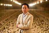 Poultry farmer with chicks