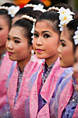 Young Thai women in traditional costume at Thailand Tourism Authority Golden Jubilee Grand Reception; Bangkok, Thailand.