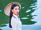 Vietnamese woman wearing Ao Dai dress during the Mid autumn festiaval in Hoi An Vietnam