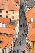 High angle view of street with tourists amongst houses in historical center of Cesky Krumlov, UNESCO World Heritage Site, Cesky Krumlov, Czech Republic (Czechia), Europe