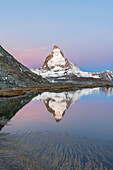 Matterhorn reflected in Riffelsee lake at dawn, Gornergrat, Zermatt, canton of Valais, Swiss Alps, Switzerland, Europe