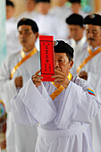 Cao Dai temple, Caodaist worshippers at ceremony, meditating followers of the Cao Dai religion, Tan Chau, Vietnam, Indochina, Southeast Asia, Asia