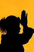 Silhouette of woman praying in temple Faith and spirituality concept, Vietnam, Indochina, Southeast Asia, Asia