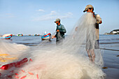 Fishermen repairing fishing nets, Hang Dua bay, Vung Tau, Vietnam, Indochina, Southeast Asia, Asia