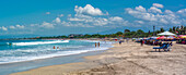 View of sunshades on sunny morning on Kuta Beach, Kuta, Bali, Indonesia, South East Asia, Asia