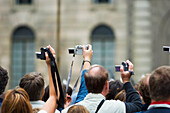 Crowd Of Tourist With Digital Cameras And Video Cameras.