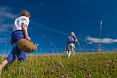 Couple Going For Picnic In Meadow On The South Downs