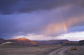 Rainbow Over Track In Glen Canyon At Dusk