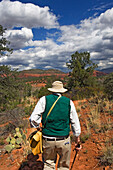 A Man On A Nature Walk Through Red Rock State Park.